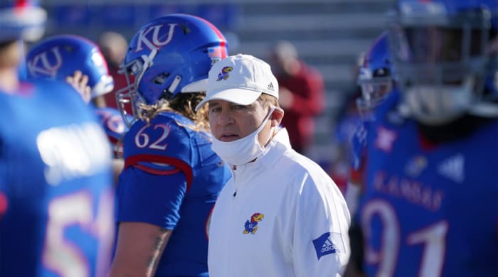 Oct 31, 2020; Lawrence, Kansas, USA; Kansas Jayhawks head coach Les Miles watches team warm ups before the game against the Iowa State Cyclones at David Booth Kansas Memorial Stadium.